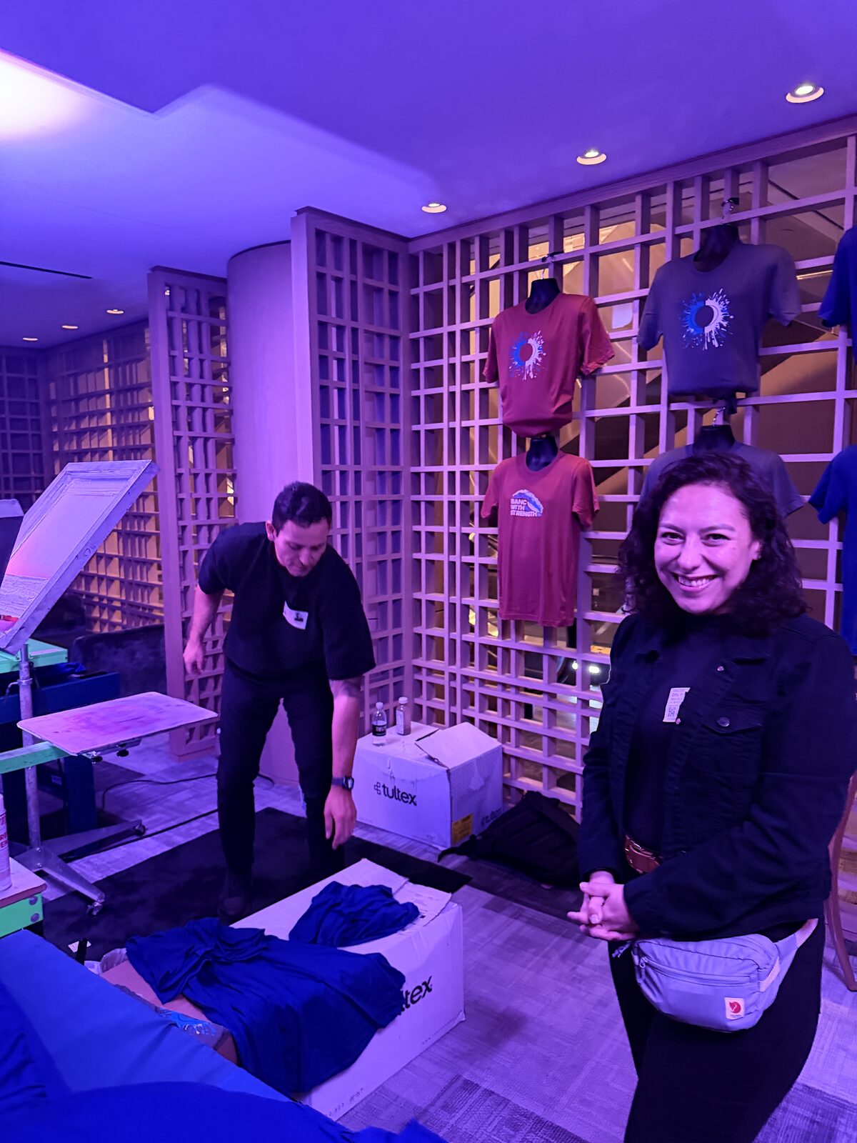 Merch Troop live printing — fresh prints off the platen